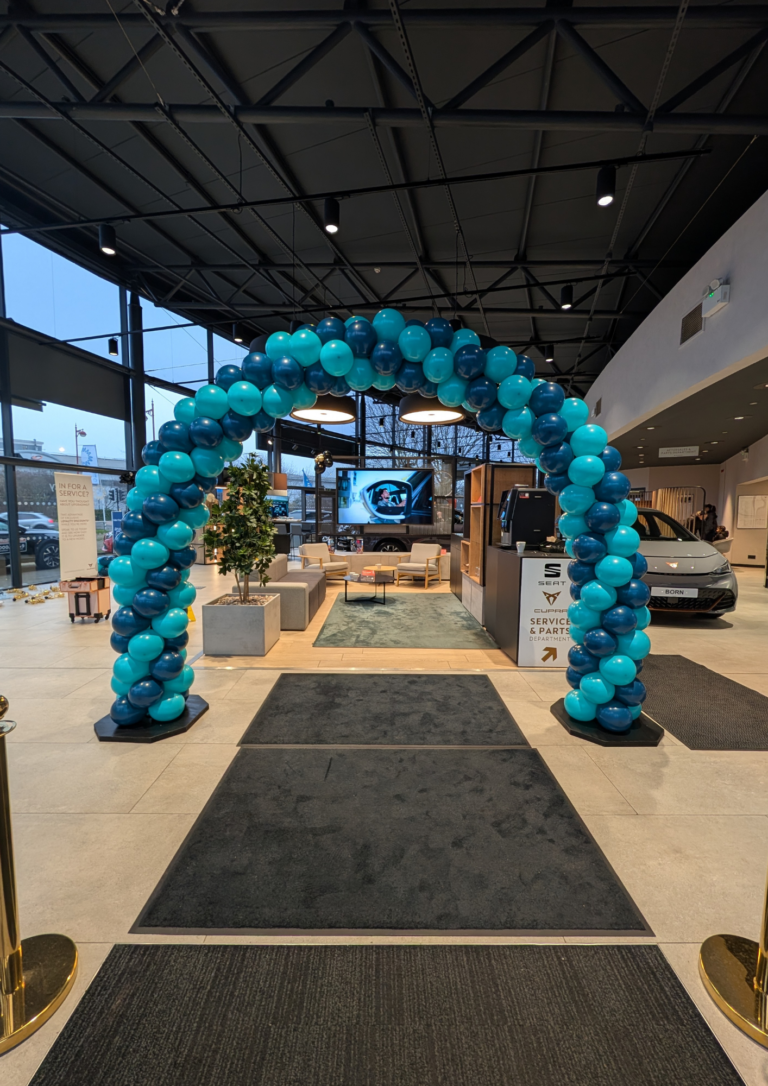 Elegant white helium balloons styled on a classic wedding car for a newly married couple travelling from the church ceremony to their wedding reception. Wedding balloon decorations designed and installed by Balloonz UK, based in Derby and covering weddings across the UK.