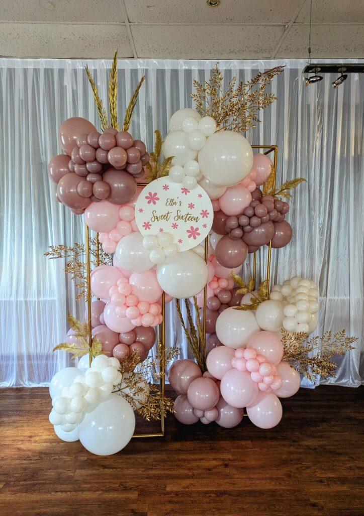 Birthday balloon garland and backdrop installation for a Sweet Sixteen celebration in Derby